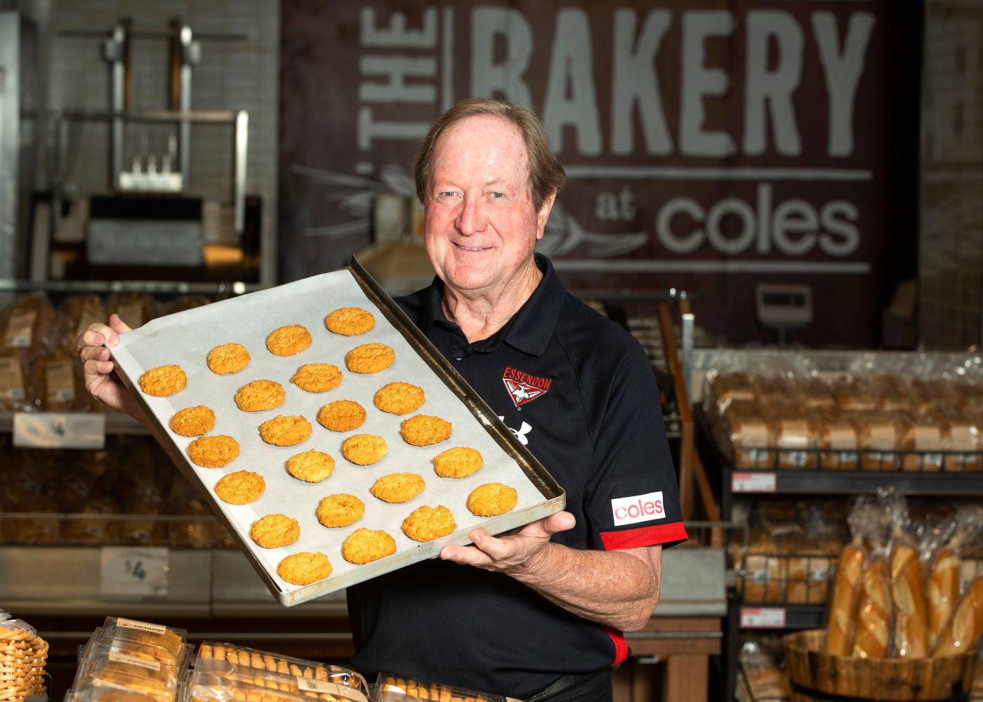 Bravery Trust Ambassador Kevin Sheedy with Coles ANZAC biscuits